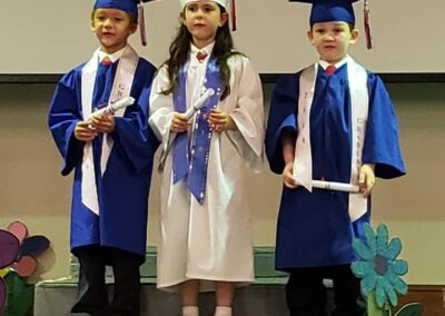 Little graduates in cap and gown