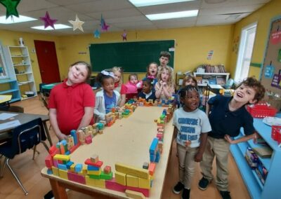 Students use a variety of blocks of shapes and sizes to create a perimeter