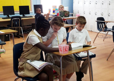 Students sitting at a desk learning