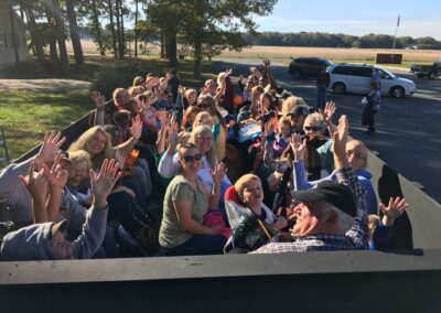 Students, parents and grandparents for a hay ride