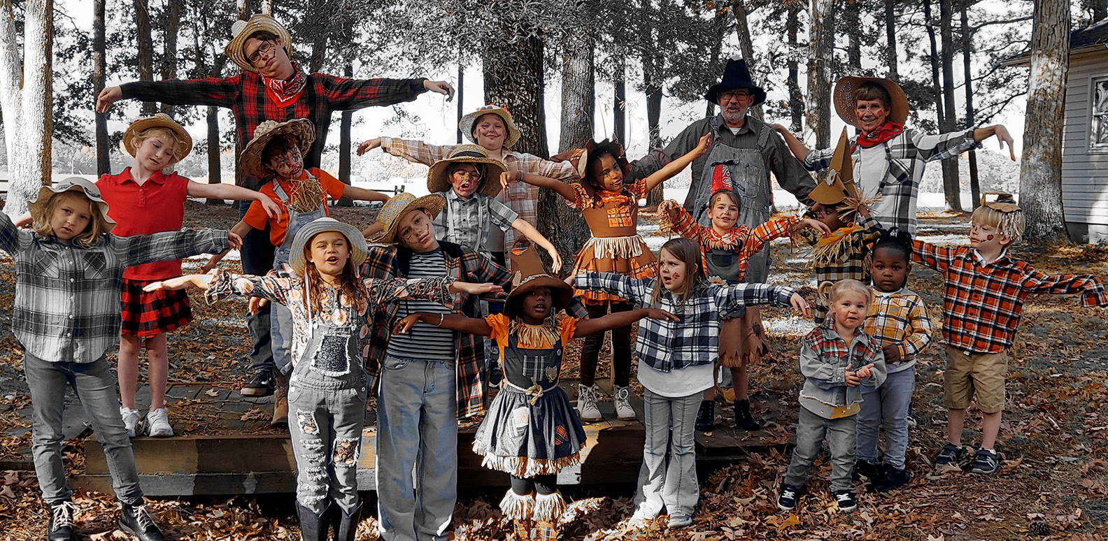 Countryside Christian kids dressed up as scarecrows